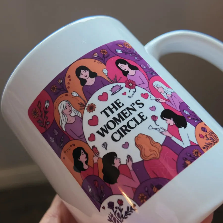 The Circle One mug held in hand